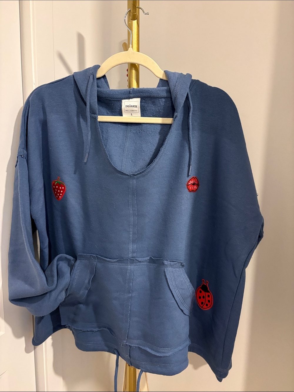 Relaxed Blue Hooded Women's Sweater with Playful Red Patches